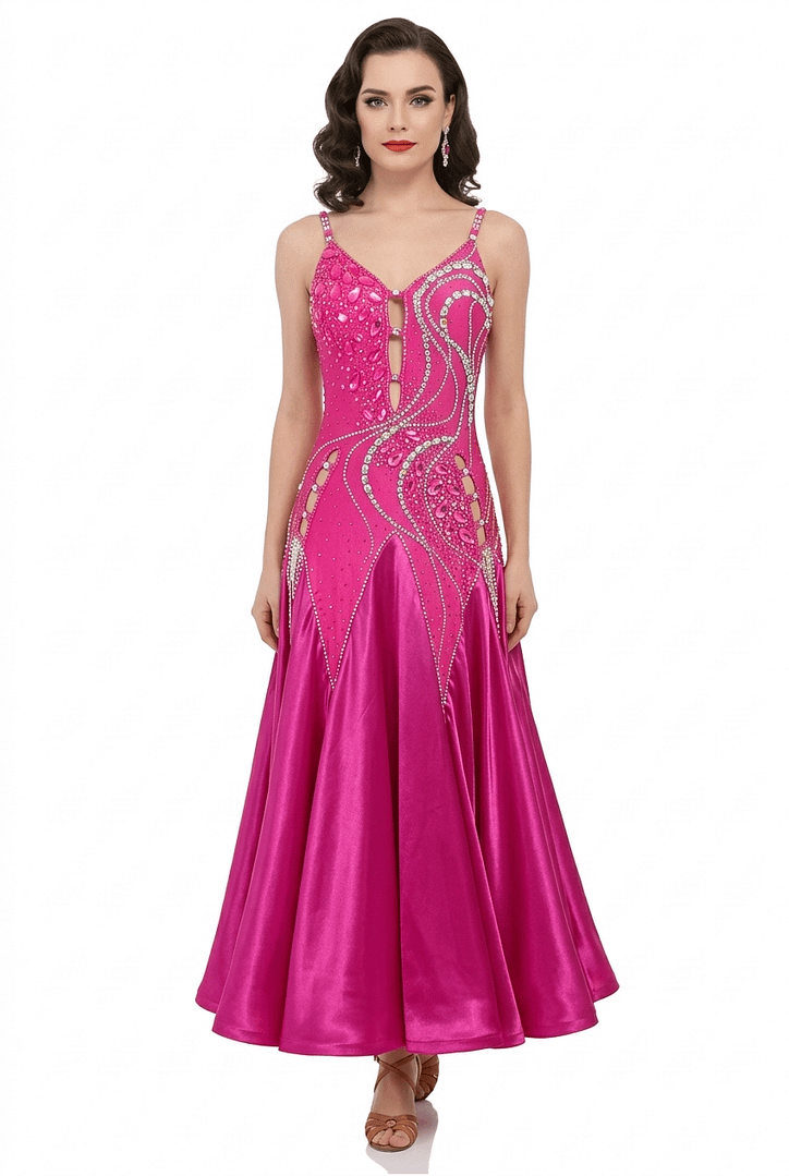 Bold, vibrant, and effortlessly captivating, Malibu Dream is a ballroom gown created for dancers who want to command attention with color, sparkle, and fluid movement. This striking hot pink design blends radiant energy with refined elegance, delivering a look that feels both playful and powerfully sophisticated. The bodice is richly embellished with dense rhinestones and luminous crystal stones arranged in flowing, sculpted patterns that enhance and contour the figure. A delicate front cutout detail adds modern allure while maintaining a polished and elegant finish. The fitted silhouette elongates the body’s lines, while the intricate crystal placement catches the light from every angle, creating a dazzling visual effect on the floor. Flowing into a luxurious satin skirt, Malibu Dream offers beautiful fullness and graceful movement with every step. The soft, sweeping fabric creates a dynamic contrast to the structured bodice, ensuring both comfort and dramatic presence in motion. From the brilliant crystal detailing to the vibrant color and fluid skirt, Malibu Dream is designed for dancers who want high visibility, confident expression, and timeless ballroom glamour. Features Ballroom gown Vibrant hot pink color for standout floor presence Embellished with dense rhinestone work and large crystal accents Elegant front cutout detail Flattering fitted silhouette Luxurious satin skirt for smooth, flowing movement Designed to shimmer beautifully under ballroom lighting Size 2–4 Perfect For Smooth, showcase performances, and dancers who want bold color with a glamorous, high-impact look.
