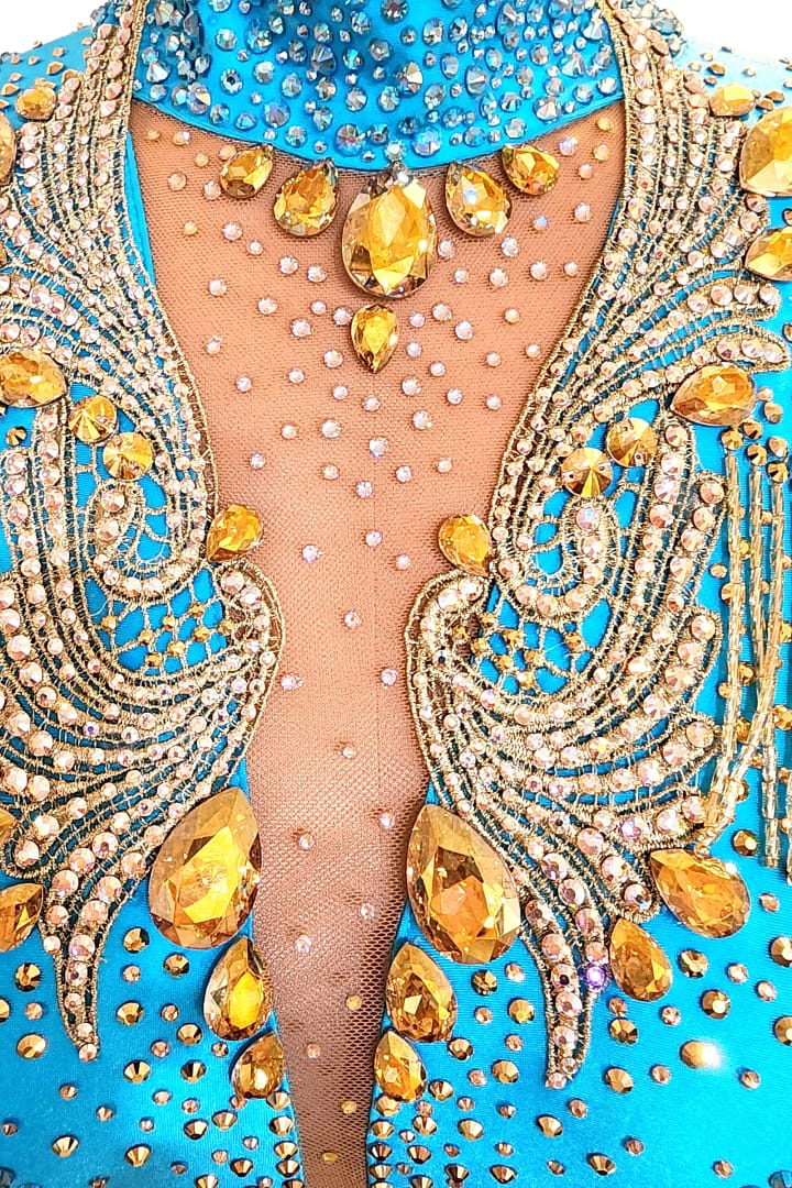 Hadley-ballroom gown — stonework close-up — dense gold and AB crystals with intricate patterns