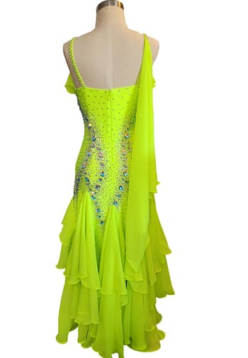 Back view of Electric Citrine ballroom gown with layered chiffon godets and elegant drape