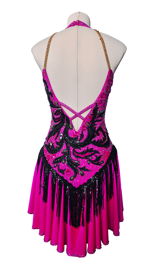 Back view of Performance – Fuchsia Dominion Latin dress featuring open back straps, black beaded lace, and crystal detailing.