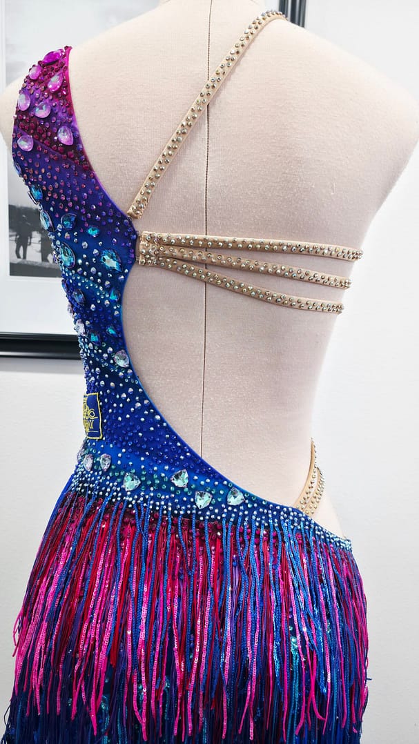 Chromatic Fire Latin dress back view with rhinestone straps and open back design