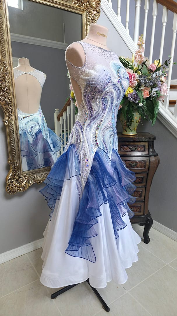 Crystal Current white dance dress shown from the side with blue and lilac ruffled skirt and crystal embellishment