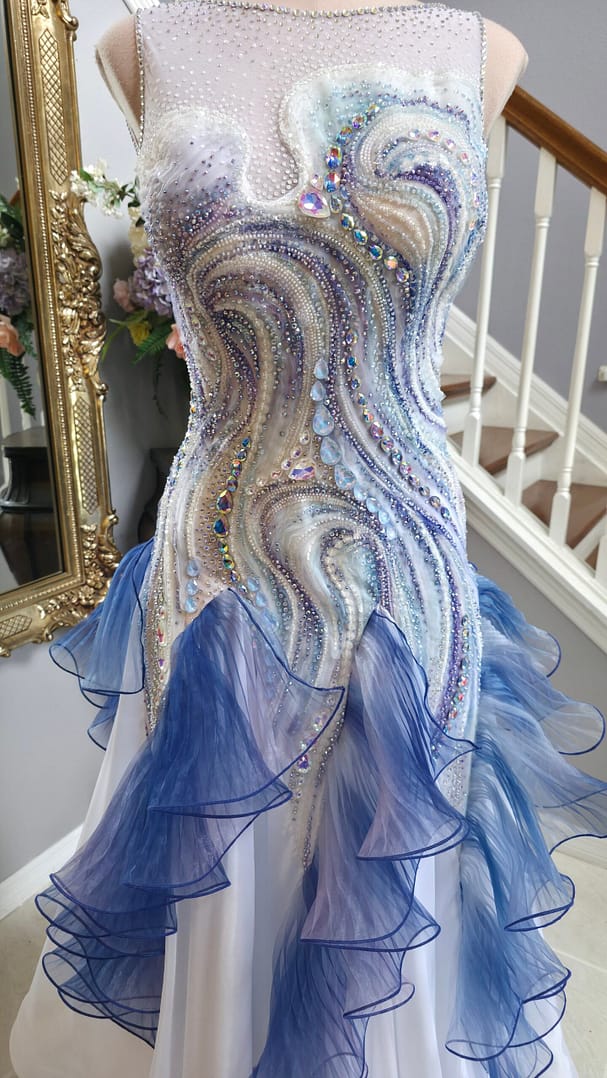 Detailed view of Crystal Current’s intricate wave-pattern embellishment with shimmering crystals and sequins