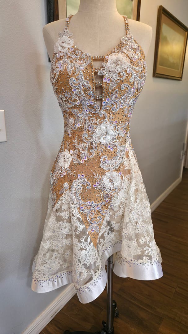Lace Temptation dress shown from the front, featuring an embellished fitted bodice and floral lace skirt
