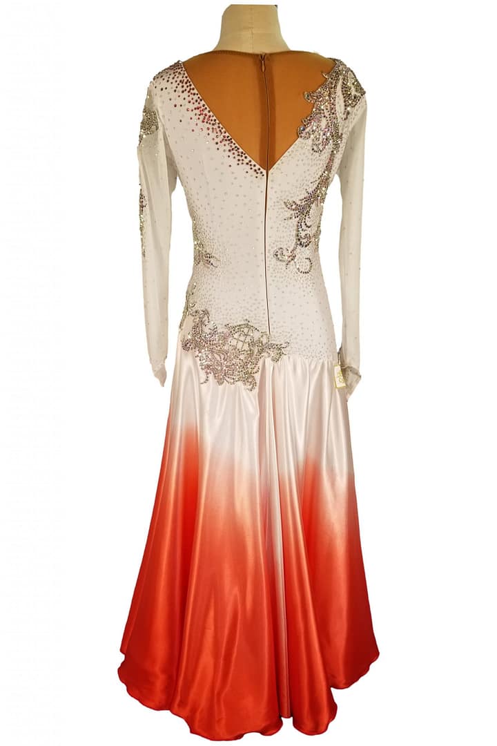 Mercedes ballroom gown — back view — Full-length view of the dress, showing the white-to-red ombré skirt and a deep cutout back highlighted by black crystal-work straps. The black velvet appliqué continues down the back.