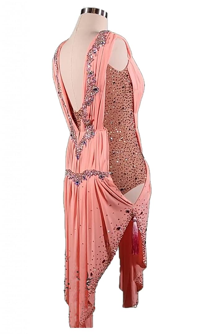 Blush Radiance Latin dress 3/4 view draped asymmetrical skirt with nude mesh side panel and crystal embellishment