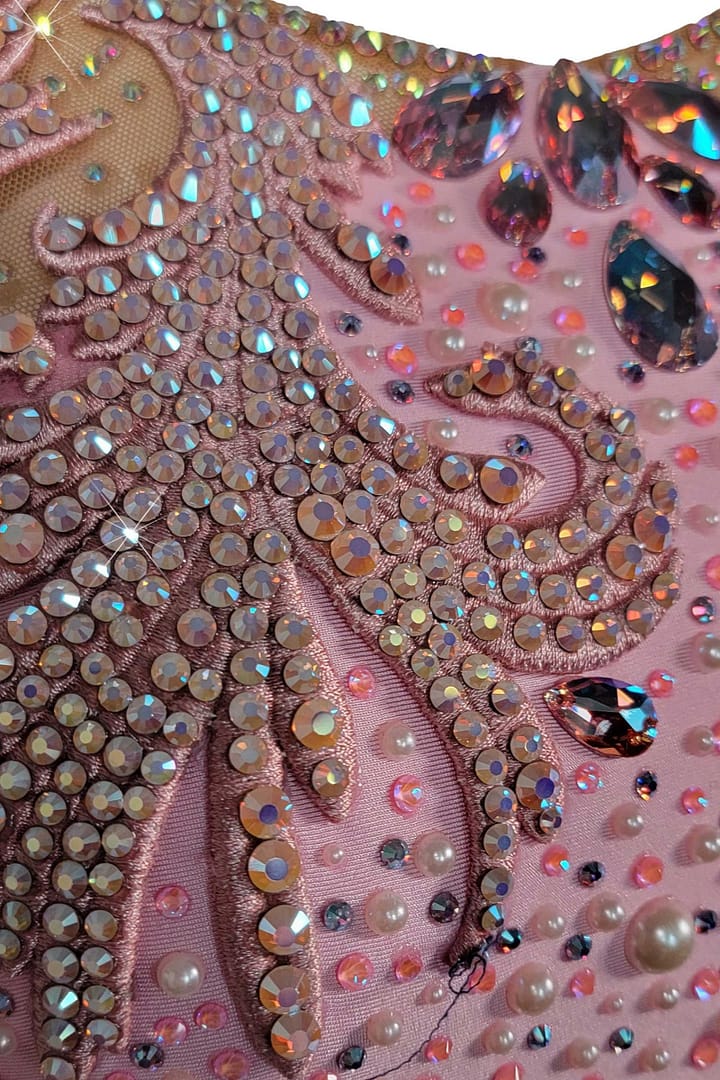Cari ballroom gown — stonework close-up — Macro detail of the high-quality AB (Aurora Borealis) rhinestones in various sizes applied in tight rows to catch the light.