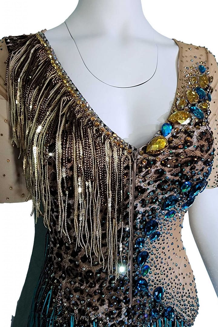 Tiger Latin Dress — bodice detail — close-up of the V-neck showing brown and gold micro sequin fringe over leopard print and large yellow and blue crystals
