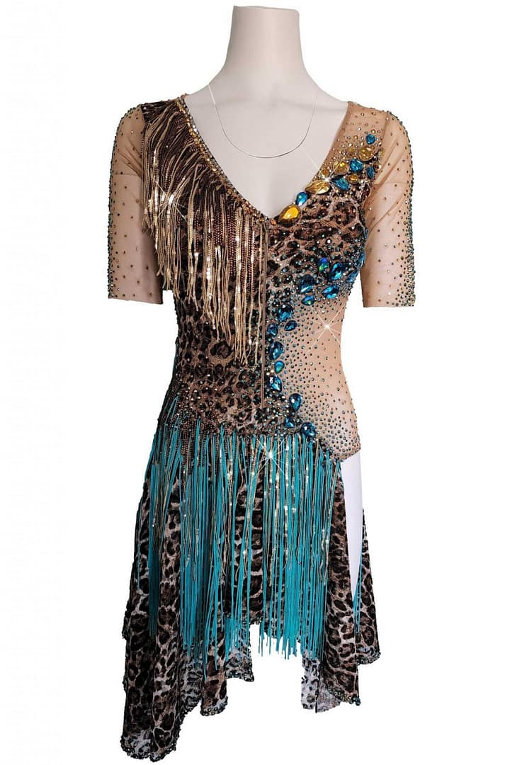 Tiger Latin Dress — in mannequin — front view of leopard print dress with nude mesh, gold fringe at the V-neck, and large blue stonework