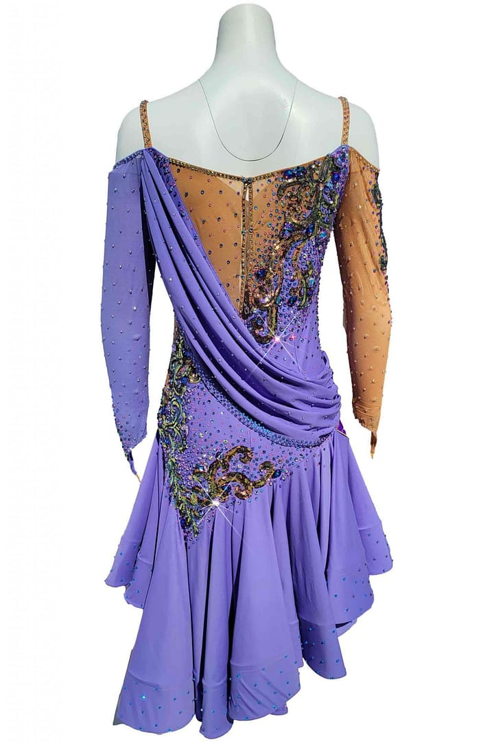 Clea Latin Dress — back view — mannequin displaying diagonal back draping, nude mesh panel, and crystal appliqué