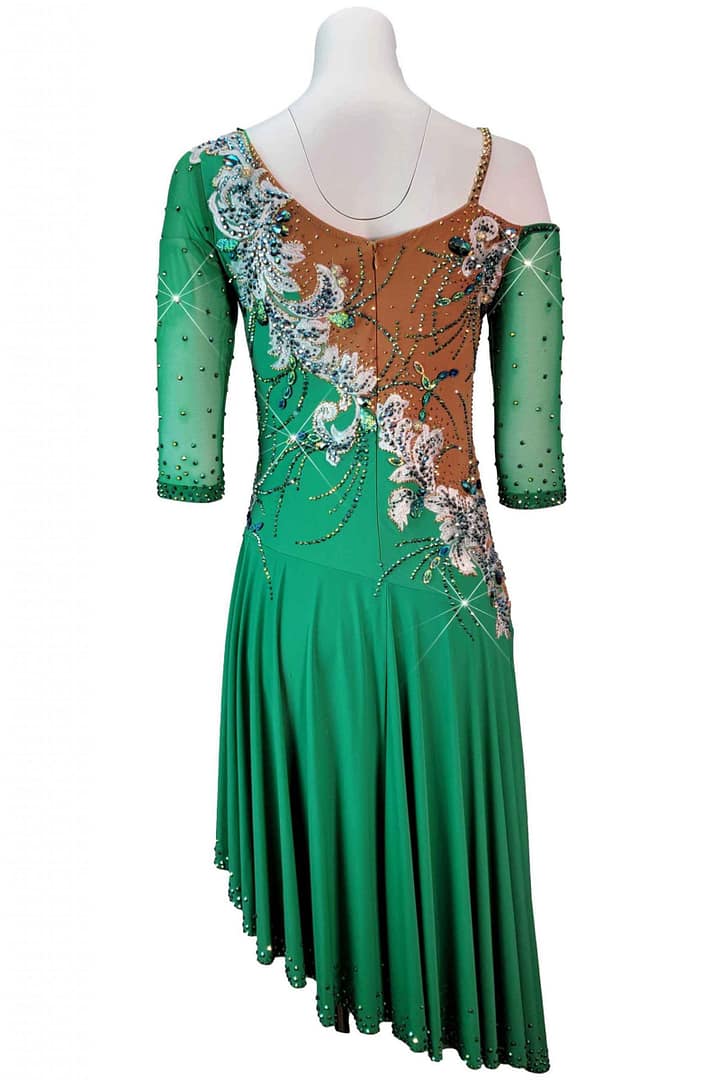 Emerald Motion Latin dress back view nude mesh paneling and the continuation of the white and blue floral appliqué motif across the back bodice.
