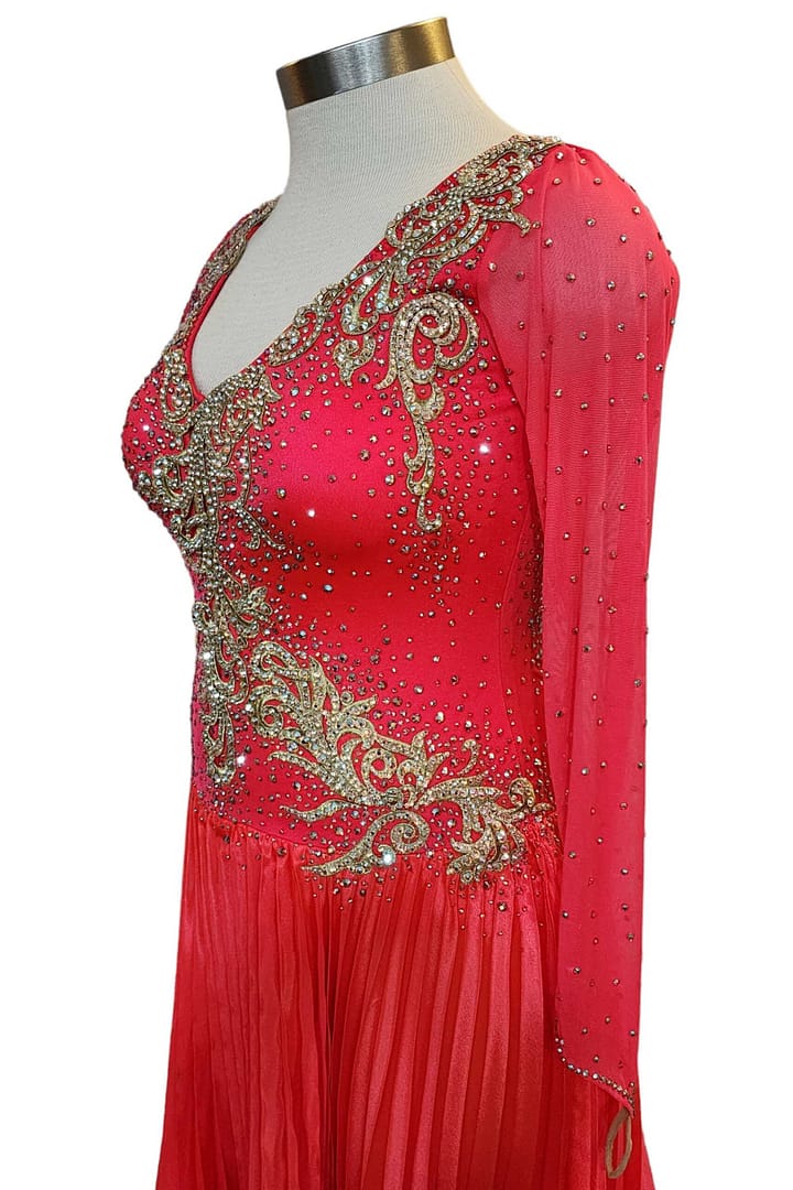 Cory ballroom gown — 3/4 side view — flowing pleated red skirt with gold stoning accents