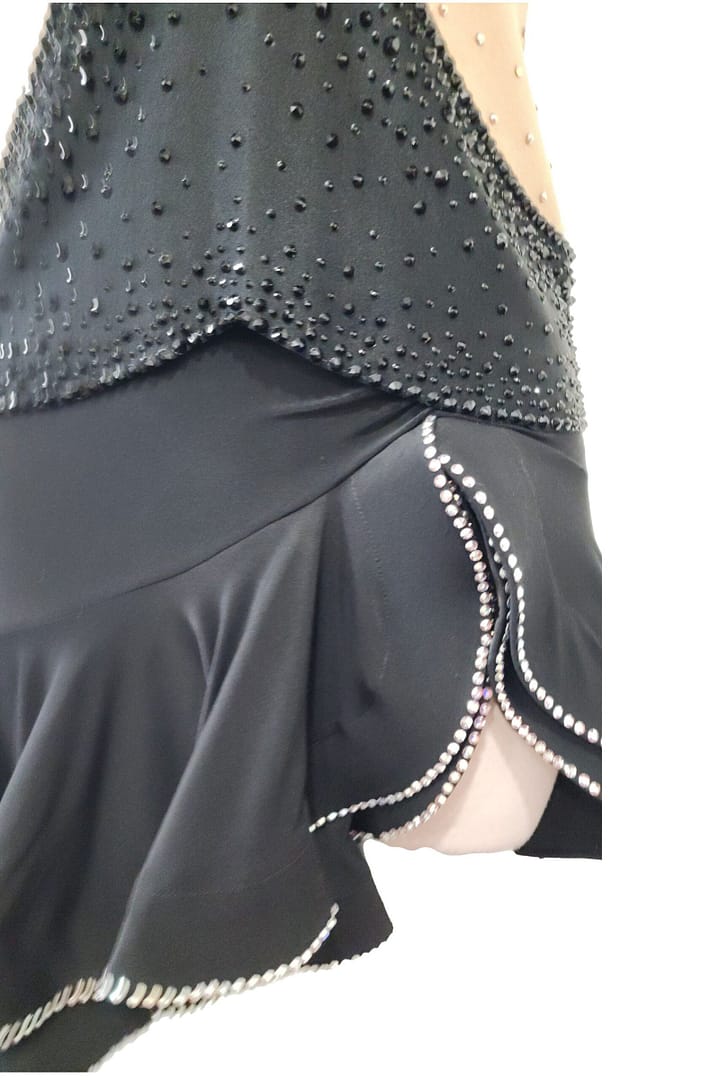 Back view of Midnight Rhythm Performance convertible ballroom gown with nude illusion open-back design, black crystal bodice, and long flowing Smooth skirt.
