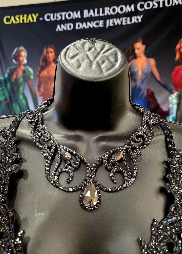 Black crystal ballroom necklace worn on mannequin at dance costume display