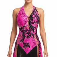Performance – Fuchsia Dominion Latin dress worn by a model, featuring fuchsia fabric, black beaded lace, and fringe for competition movement.