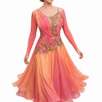 Professional dancer in the Silken Radiance gown, showing movement in the coral ombre sunburst pleated skirt.