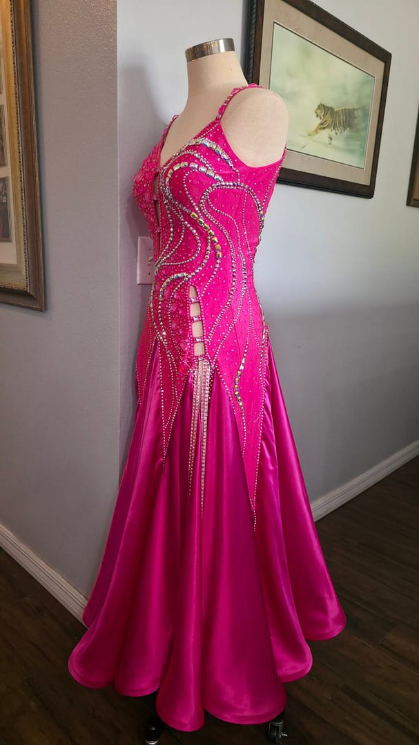 Side view of Malibu Dream ballroom gown showing fitted silhouette and flowing pink skirt