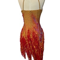 Back view of the Inferno Cascade dress featuring an open-back design with delicate straps and a gradient of red and gold crystals.