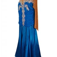 Paz Ballroom Dress – Right Side View — royal-blue ballroom gown with nude mesh sleeves, ruched bodice, and sparkling silver appliques cascading from neckline to skirt.