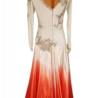 Mercedes ballroom gown — back view — Full-length view of the dress, showing the white-to-red ombré skirt and a deep cutout back highlighted by black crystal-work straps. The black velvet appliqué continues down the back.