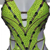 Sunshine Latin dress — bodice detail — close-up of neon yellow fabric with purple and black teardrop crystals