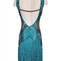 Undina Latin Dress — back view — mannequin displaying a deep scooped back with a securing crystal strap and full teal fringe skirt