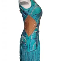 Undina Latin Dress — 3/4 view — mannequin showing side contouring, thick teal fringe, and scalloped crystal hip detail