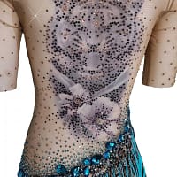 Tiger Latin Dress — back detail — close-up of the tiger head tattoo on nude mesh, accented by turquoise and brown crystal stoning