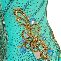 Ashcroft Latin Dress - stonework close‑up - Gold scrollwork, AB crystal tear drops, and cutouts with fringe.