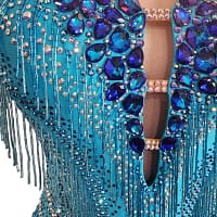 Carla Latin dress — stonework detail - close-up of neckline showing large royal blue teardrop crystals around a keyhole cutout and fringe.