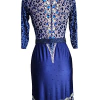 Pala Latin Dress — back view — High-neck back bodice featuring the blue leopard print and a dramatic vertical line of large, assorted blue and AB teardrop crystals down the spine.
