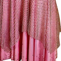 Seraphina Latin dress — skirt detail — blush pink double-layered skirt with crystal mesh overlay and scattered rhinestones at the hem.