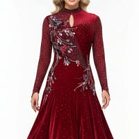 Talia Latin dress — front view — long sleeves, pleated velvet skirt, and diagonal red appliqué embellishment.