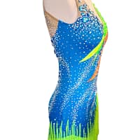 Rio Swirl Latin dress — side view — showcasing the bold striped pattern on the side and the layered fringe movement.