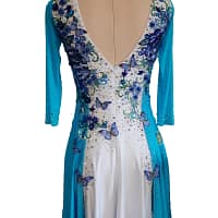Back view of Azure Grace Latin dress featuring deep V-back neckline with blue floral embroidery and rhinestone accents