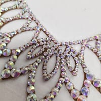 Close-up of Crystal AB stones on Aurora ballroom necklace with clear color and high-reflection shine.