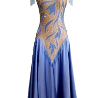 Blue Silhouette Atelier ballroom dress displayed on a mannequin with crystal-framed neckline, shoulder fringe accents, and soft full-length blue skirt.