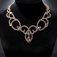 Crystal ballroom necklace displayed on a black jewelry bust