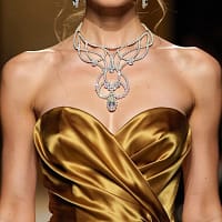 Crystal ballroom necklace worn with gold evening gown for stage and competition