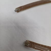 Back view of ballroom necklace showing silicone backing and fastening loops