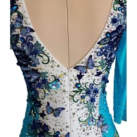 Close-up of Lavinia Latin dress back neckline with embroidered blue florals, butterflies, and dense crystal embellishment