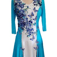 Lavinia Latin dance dress front view with turquoise sleeves, white bodice, butterfly appliqués, and crystal detailing