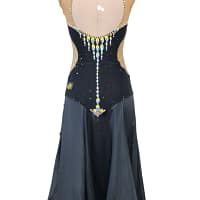 Back view of Midnight Rhythm convertible ballroom gown with nude illusion open-back design, black crystal bodice, and long flowing Smooth skirt.