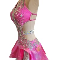 Close-up of Radiant Motion bodice with crystal swirl appliqué and geometric stones