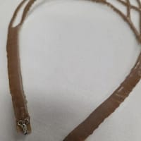 Back view of ballroom necklace showing silicone backing and secure closure for dancing