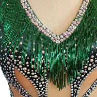 Close-up of emerald green Latin dress bodice with crystal fringe necklin