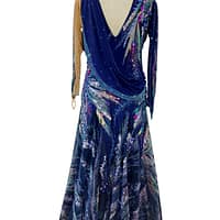 Back view of Royal Horizon ballroom dress featuring deep V-back, crystal embellishments, and layered printed chiffon skirt