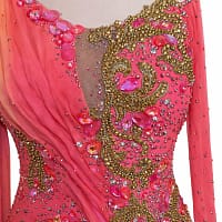 Close-up of Silken Radiance bodice featuring hand-placed pink gemstones and intricate gold beaded embroidery.