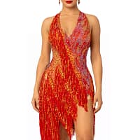 A woman wearing the Inferno Cascade Latin dance dress featuring red fringe, gold sequins, and intricate crystal embellishments.