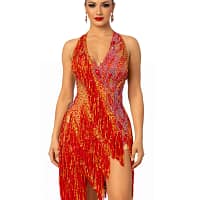 A woman wearing the Inferno Cascade Latin dance dress featuring red fringe, gold sequins, and intricate crystal embellishments.